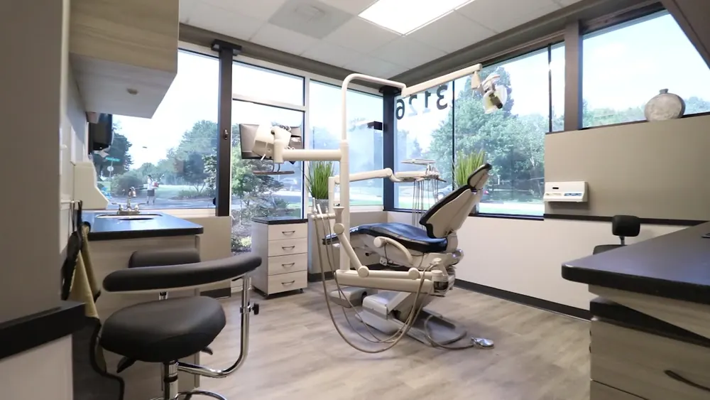 Chairside view of the treatment room with a clinician stool and counter