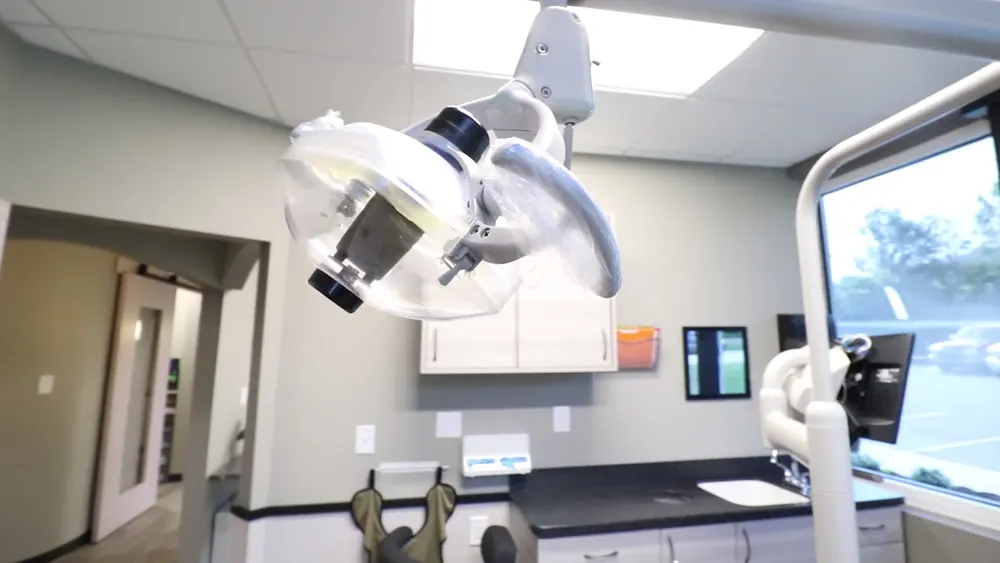 Overhead exam light and cabinets in a modern dental operatory